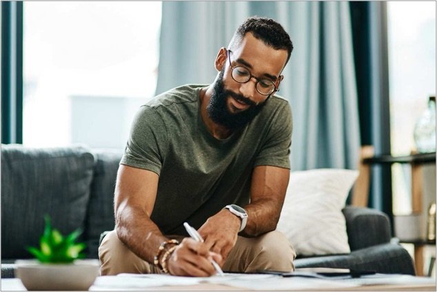 Professional writing in a notebook while learning AI